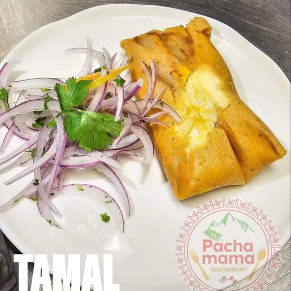 A Peruvian tamal with a cheesy filling, served with red onion and cilantro salad.